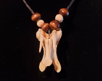 Unknown animal vertebrate necklaces on black hemp cord with small tan and brown beads