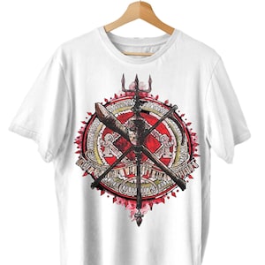 May include: White t-shirt with a red and gold graphic design of a trident and other weapons. The design is surrounded by a circle with a repeating pattern.