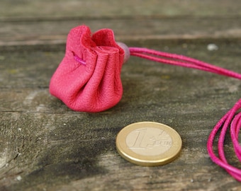 Micro leather bag (approx. 3 cm base diameter) made of pink leather with a fuchsia leather strap for hanging around the neck for rings, pendants, stones