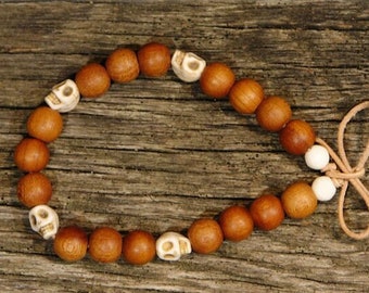 Bracelet with wooden beads and small skulls