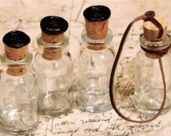 Set of 4 bottles (3x sealed in black + 1x knotted cork, without seal)