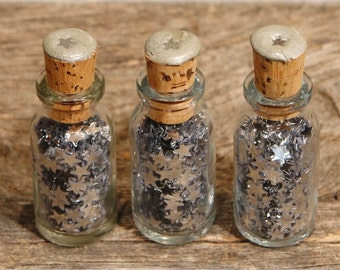 Silver shooting stars in a bottle
