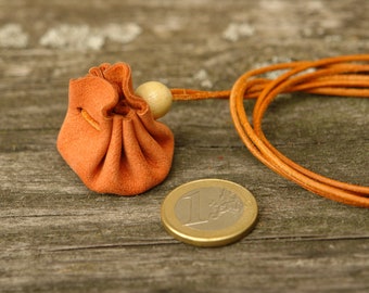 Micro leather bag (approx. 3 cm base diameter) made of rust-colored leather with an orange leather strap for hanging rings, pendants, coins