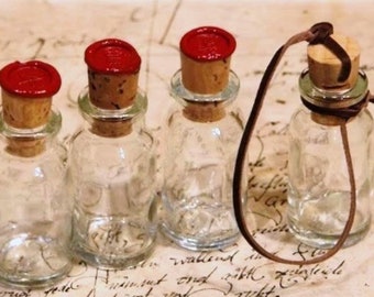 Set of 4 bottles (3x sealed in red + 1x knotted cork, without seal)