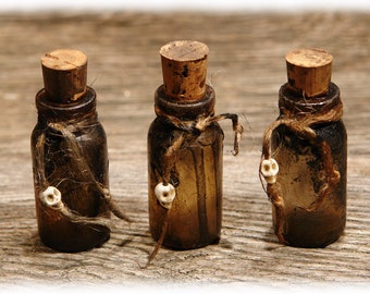 Set of 3 aged Halloween vials, dark