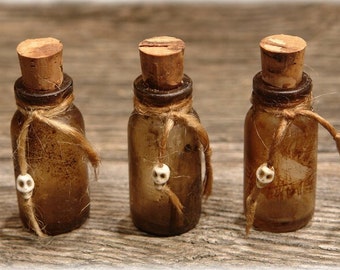 Set of 3 aged Halloween bottles, rather light