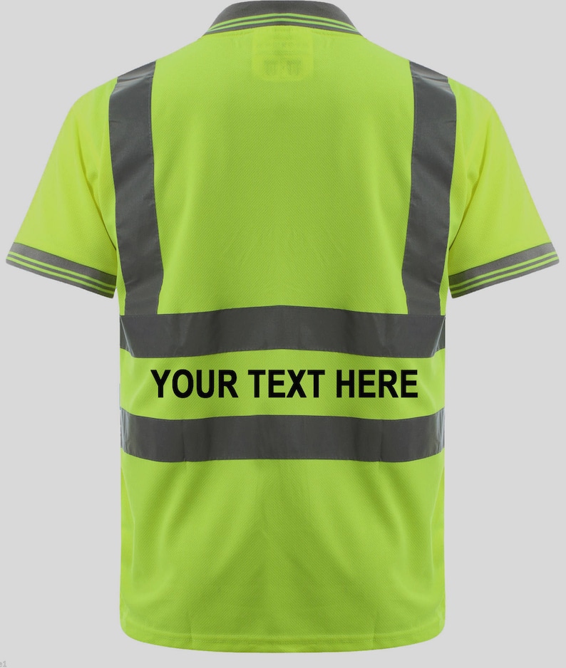 May include: A bright yellow safety polo shirt with reflective black stripes and the text "YOUR TEXT HERE" printed on the back.