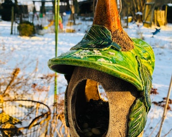 Ceramic bird feeder with green roof