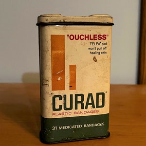 Ouchless Curad Plastic Bandages Tin