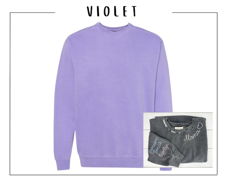 May include: A purple sweatshirt with a crew neck. A second sweatshirt is folded on top of the first sweatshirt. The second sweatshirt is dark gray with white embroidery that says "Mama" and "Jameson, Jonah, Scotlyn".