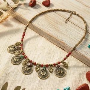 Boho Beaded Koru Symbol Necklace: Ethnic Spiral Pendant