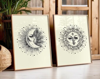 May include: Two framed prints with a vintage aesthetic. The left print features a crescent moon with a face and radiating rays. The right print features a sun with a face and radiating rays.