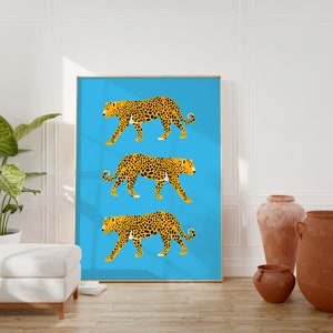 May include: Three stylised leopards in orange and black are walking across a bright blue background. The leopards are in a row, one above the other.