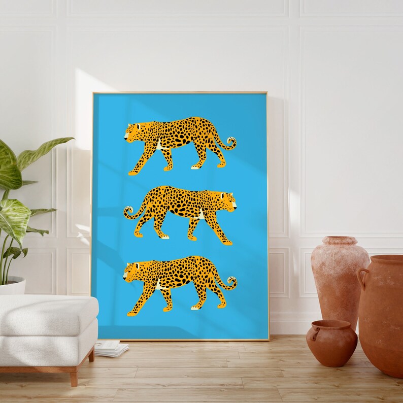 May include: Three stylised leopards in orange and black are walking across a bright blue background. The leopards are in a row, one above the other.