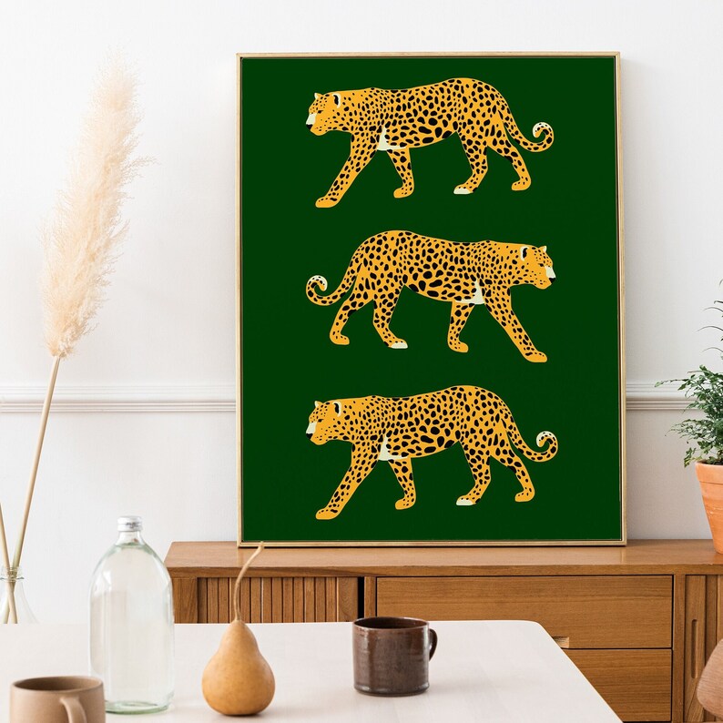 May include: A digital art print featuring three stylized leopards in yellow and orange on a dark green background.