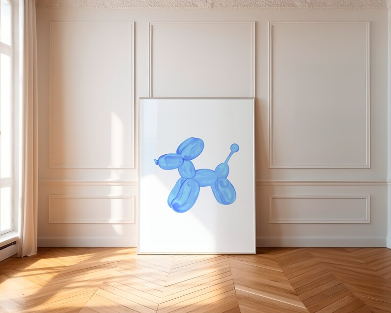 May include: A blue balloon animal shaped like a dog is displayed in a white frame against a white wall.