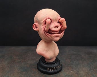 Smiling baby creepy sculpture, horror decor