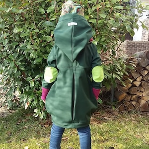 Softshell coat with arm patches and floral appliqués