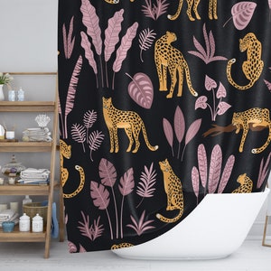 May include: A black shower curtain with a repeating pattern of pink leaves and orange leopards. The leopards are in various poses, some standing, some sitting, and some walking.