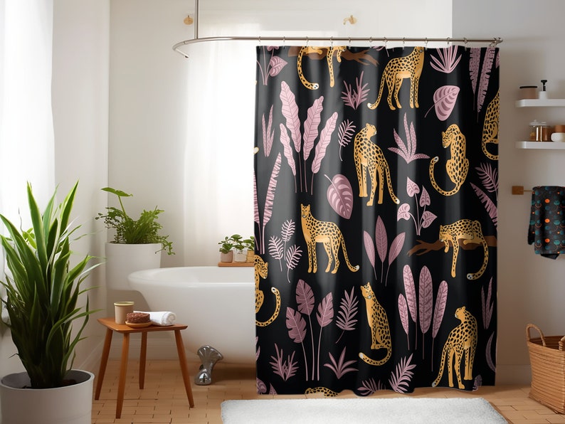 May include: Black shower curtain with a repeating pattern of pink and green tropical leaves and yellow leopards.