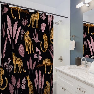 May include: A black shower curtain with a repeating pattern of pink and green leaves, and yellow leopards.