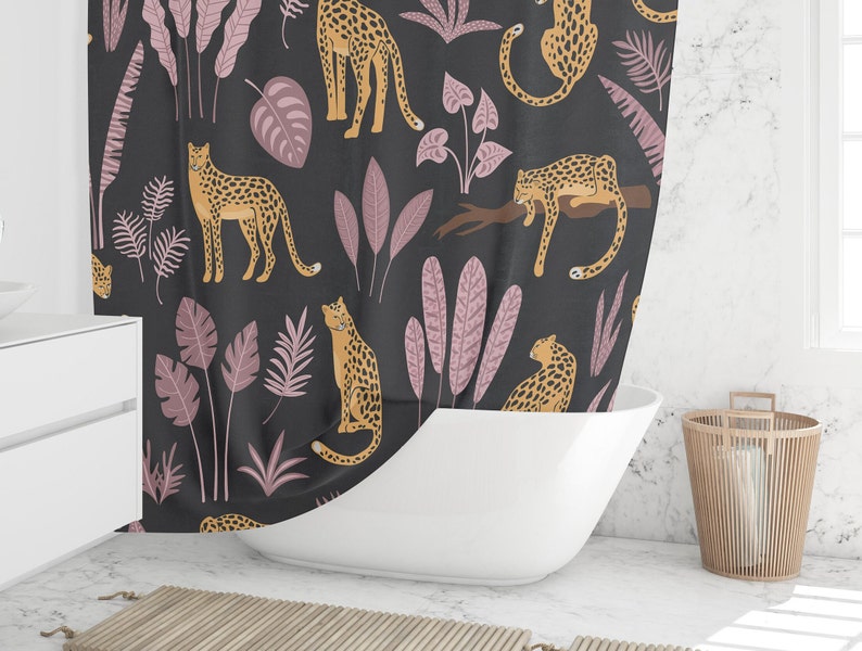 May include: A black shower curtain with a repeating pattern of pink leaves and orange leopards. The leopards are in various poses, including standing, sitting, and lying down.