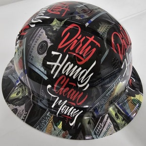May include: Black hard hat with a graphic design of dollar bills and the text "Dirty Hands Clean Money".