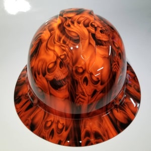 Full brim hydro dipped custom hard hat in orange hear no see no evil skulls osha approved