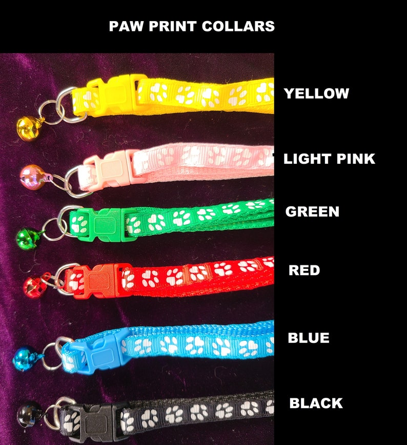 May include: Six cat collars in different colours with paw print designs and a bell. The colours are yellow, light pink, green, red, blue and black.