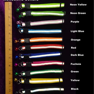 May include: A set of 12 reflective dog collars in various colours, including neon yellow, neon green, purple, light blue, orange, red, dark blue, fuchsia, green, yellow, and black. Each collar has a white reflective strip and a small bell.