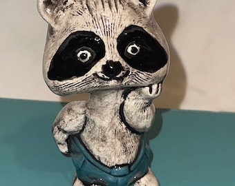 Vintage Porcelain Raccoon Figurine With Blue Shorts On