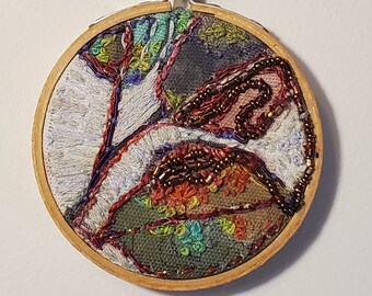 Hand embroidered floral hoop.