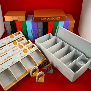 May include: A set of gray and beige plastic organizers for a board game. The organizers have labels for "Skills", "Locations", "Allies", "Spells", "Ass/Race", "Contains", "Forests", "Adds", and "As".