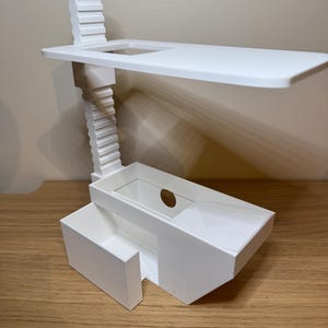 May include: White plastic plant stand with a shelf, a small drawer, and a clear plastic container. The stand has a vertical adjustable height.