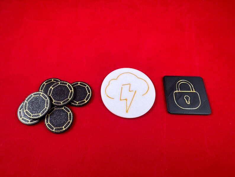 May include: A set of black and gold poker chips, a white round token with a gold lightning bolt inside a cloud, and a black square token with a gold padlock.