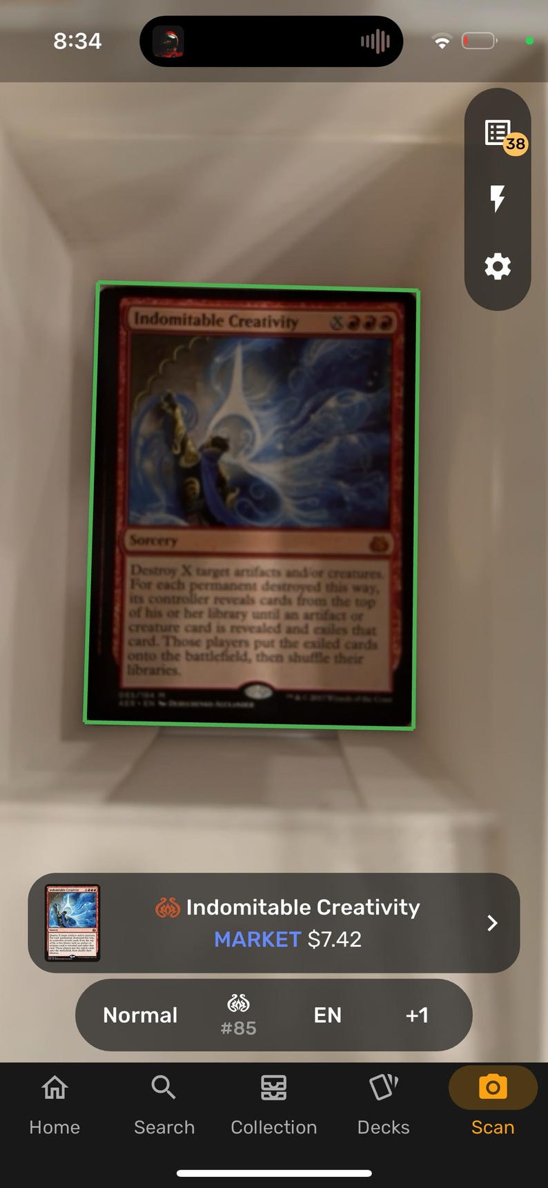 May include: A Magic: The Gathering card called "Indomitable Creativity". The card is red and blue with a white background. The card shows a person holding a blue orb with white light coming from it. The card text reads "Destroy X target artifacts and/or creatures. For each permanent destroyed this way, its controller reveals cards from the top of his or her library until an artifact or creature card is revealed and exiles that card. Those players put the exiled cards onto the battlefield, then shuffle their libraries."