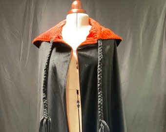 Women's cape with hood.