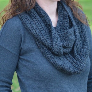 close up of charcoal infinity crochet scarf