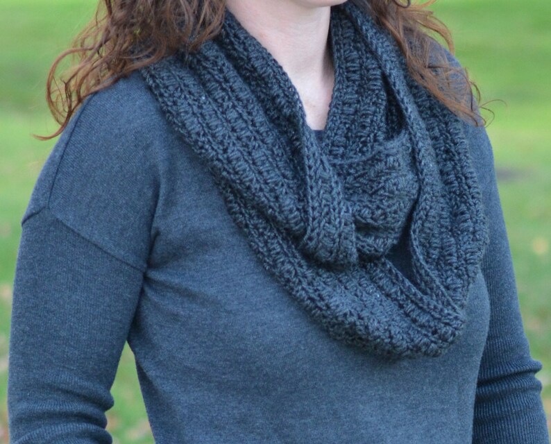 close up of charcoal infinity crochet scarf