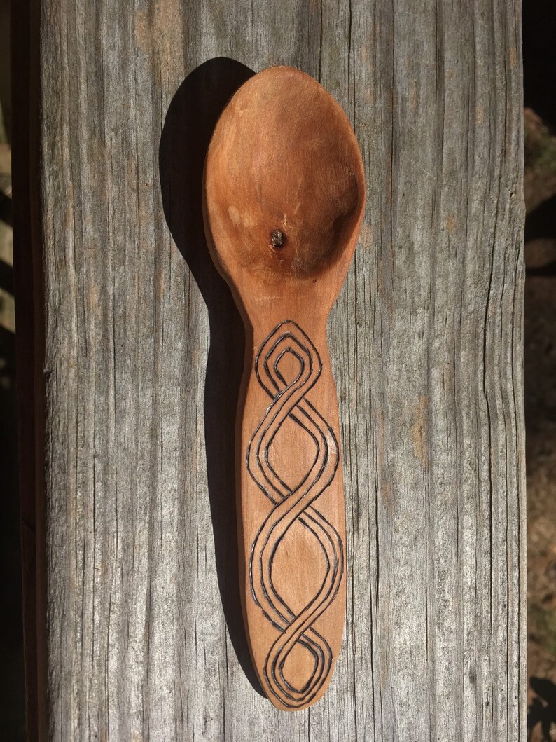 Wooden spoon with pyrography design