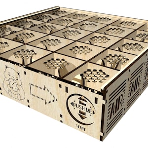 May include: A wooden puzzle box with a grid of compartments and a small animal illustration on the front. The box has a "PUSH ME" button and the word "START" printed on the bottom. The box is made of light brown wood and has a textured surface.