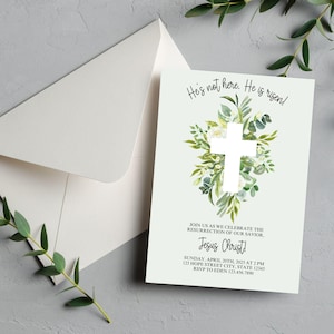 May include: A green and white Easter invitation with a white cross surrounded by greenery and white flowers. The text reads "He's not here. He is risen!" and "Join us as we celebrate the resurrection of our Savior, Jesus Christ!"  Sunday, April 20th, 2025 at 2 PM. 123 Hope Street City, State 12345. RSVP to Eden 123.456.7890.