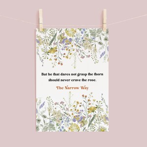 May include: A white printable art print with a floral border and a quote in brown text that reads "But he that dares not grasp the thorn should never crave the rose. The Narrow Way."