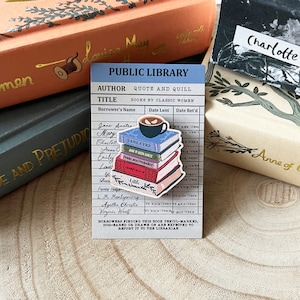 May include: A stack of books with titles like "Jane Eyre", "Pride and Prejudice", and "Little Women" are piled on top of a cup of coffee. The books are on a library card with the words "Public Library" and "Books by Classic Women".