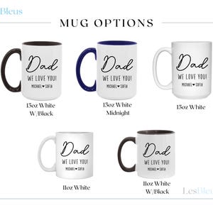 May include: White ceramic mugs with black, navy blue, and white handles. Each mug has the word "Dad" in cursive, with "We love you!" and a name below. Mug sizes are 11oz and 15oz.