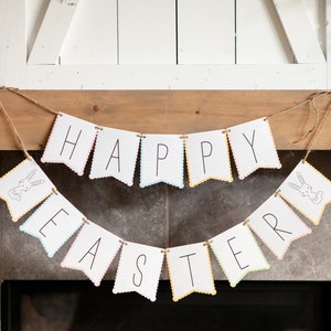 May include: A white banner with scalloped edges hangs above a fireplace. The banner reads "Happy Easter" with a bunny illustration on each end.