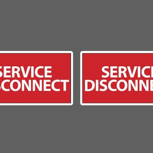 May include: Two rectangular signs with a red background and white border. The signs display the words "SERVICE DISCONNECT" in white, bold, sans-serif font. The signs are set against a gray background.