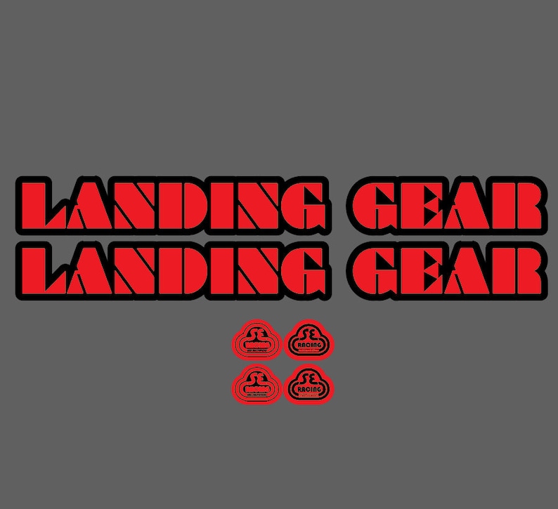 May include: Two red and black stickers with the text "Landing Gear" and two red stickers with the text "SE Racing" in a cloud shape.