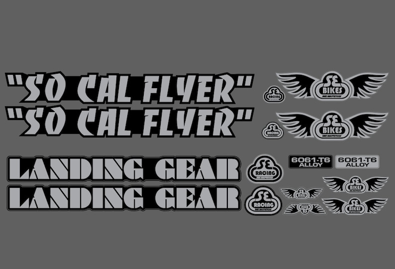 May include: A set of silver and black bicycle decals with the text "SO CAL FLYER" and "LANDING GEAR". The decals also feature the SE Racing logo and the text "6061-T6 Alloy".
