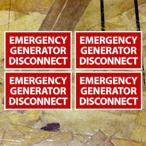 May include: Four red signs with white text on a wood background. Each sign reads "Emergency Generator Disconnect".